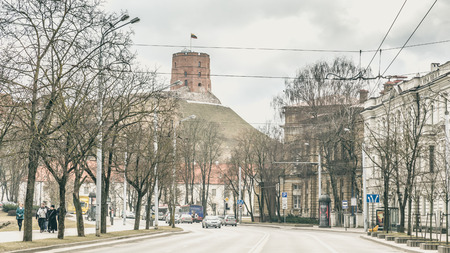 Street view with Gediminas Tower on the hill of the old town center of Vilnius, Lithuaniaの写真素材