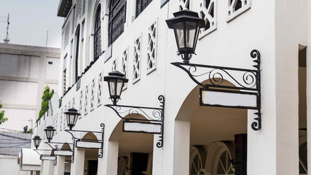 Old lamp and street signの写真素材