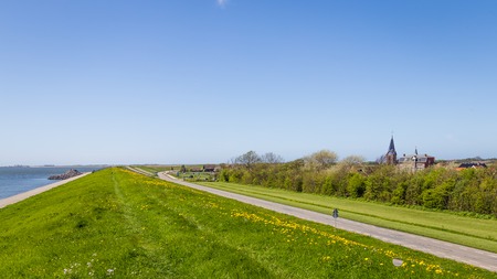 The dykes around Oudeschild on the Waddenisland Texel Nethrlands, protecitng the islland for the sea in the Netherlandsの写真素材