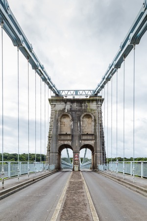 Menai Suspension Bridge between Anglesey and mainland of North Wales, UK. The bridge, opened in 1826, is known as the first modern suspension bridge in the world.の写真素材