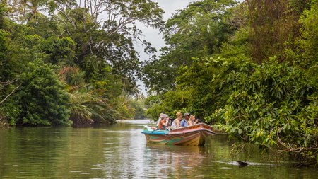 Negombo Sri Lanka July 24 2017 - Tourists take a boat ride through one of the lagoons at Negombo. There is a vast network of lagoons and canals throughout Negombo.のeditorial素材
