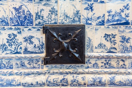 Tallinn, Estonia - September 30, 2018:  Antique heater or stove in Kadriorg Palace in Roman Baroque style in Tallinn Estland. Planned after the model of Versailles. Art meuseum of Estonia.のeditorial素材