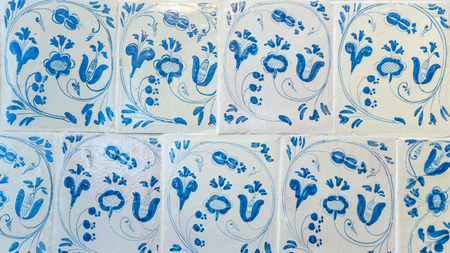 Tallinn, Estonia - September 30, 2018:  Antique tiles  on a heater or stove in Kadriorg Palace in Roman Baroque style in Tallinn Estland. Planned after the model of Versailles. Art meuseum of Estonia.のeditorial素材