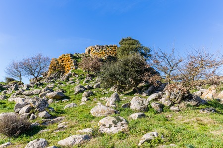 Remains of nuraghe or fortress from the bronze age at Archeological site of Tamuli, Sardinia island, Italyの写真素材