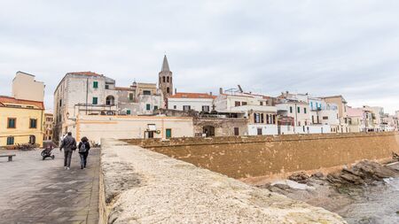 Alghero, Sardinia island, Italy - December 28, 2019:  Cityscape with the boulevard of Alghero in...