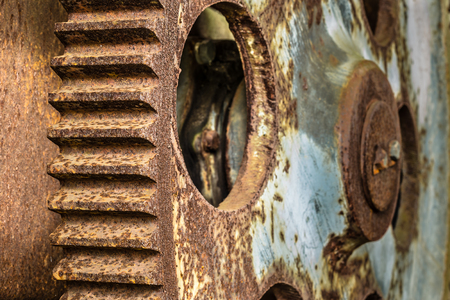 Two large rusted gear wheels in an abandoned factoryの写真素材