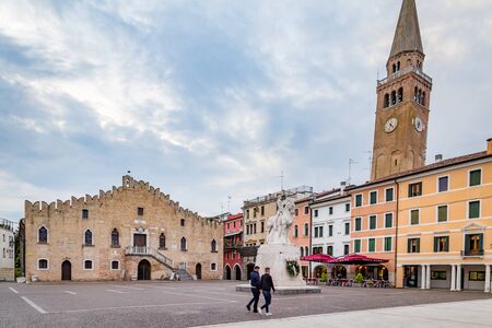 Portogruaro, Veneto Italy - May 22, 2019: Cityscape with St. Andrea clock tower, city hall and the...