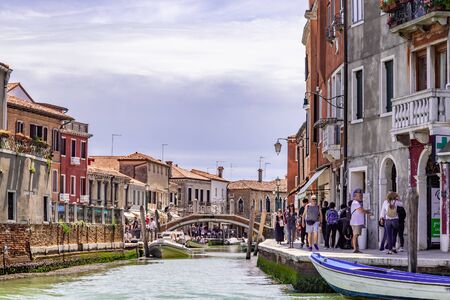 Venice Italy - May 26, 2019: Tourists walking around in Murano island, famous because of his glass and shopsのeditorial素材