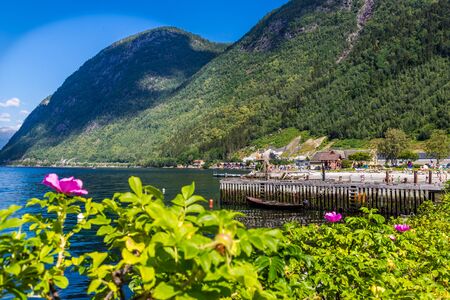 Vik, Sogn og Fordjane, Norway, Scandinavia - July 28, 2019: People swimming in Sognefjord on a hot summer day in the town Vik in Norway.のeditorial素材