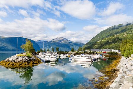 Port of Sylte or Valldal administrative center Norddal Municipality, More og Romsdal county, Norway with Valldalen valley and shore Norddalsfjordenの写真素材