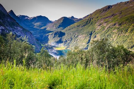 Aerial view on Geiranger town, harbor and fjord in More og Romsdal county in Norway famous for his beautiful boattrip through the fjord.の写真素材