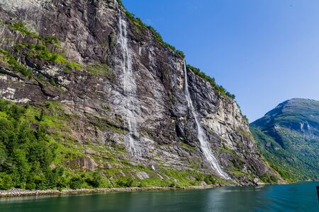 View on the famous high waterfall Seven sisters in Gerianger fjord in More og Romsdal county in Norwayの写真素材