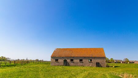Colroful summer landscpe with an old shedの写真素材