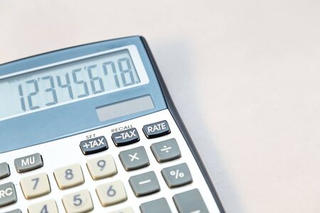 Old electronic calculator on white background