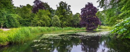 Public park English Work along river IJssel in Zwolle. The park is a natonal monument because of his...
