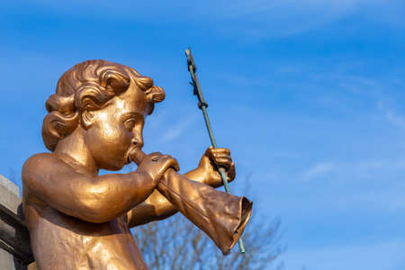 Deventer, Netherlands - January 31, 2021: Golden angel sculpture detail of the Wilhelmina fountain on central market in Deventer in Overijssel, Netherlandsのeditorial素材
