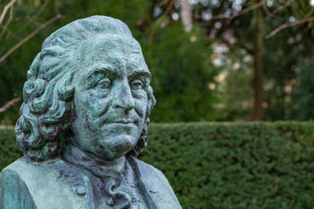 Wageningen, The Netherlands - January 21, 2021: Copper sculpture of Carl Linnaeus in public arboretum De Dreijen in Wageningen in thre Netherlandsのeditorial素材