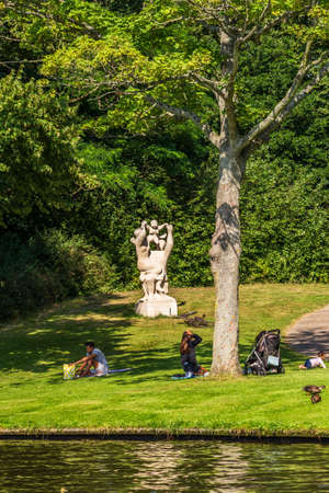 Alkmaar, The Netherlands - July 23, 2021: Picnic in park along canal during summer in Alkmaar North-Holland, The Netherlandsのeditorial素材