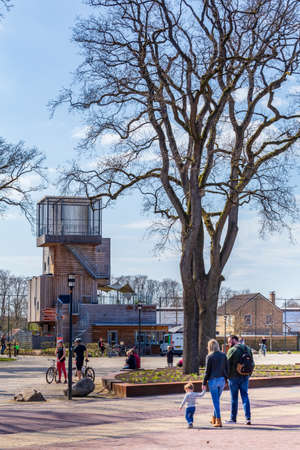 Appelscha, The Netherlands - April 18, 2021:Landscape with wooden watchtower in nature park Drents Friese Wold n near Appelscha in Denthe The Netherlandsのeditorial素材