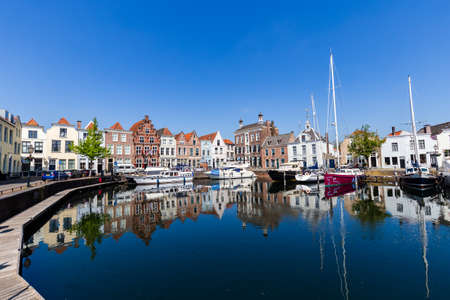 City port with colorful sailing ships in th ancient center of Goes in Zeeland in The Netherlandsのeditorial素材
