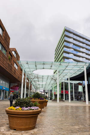 Almere, The Netherlands - April 3, 2022: Modern design of the citymall and coloful flowers in the center of Almere, Flevoland in The Netherlandsのeditorial素材