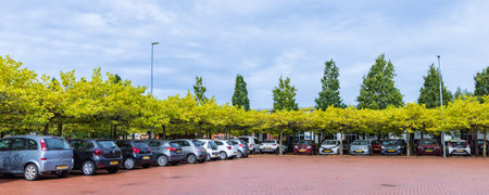 Zuidhorn, The Netherlands - September 25, 2022: City hall and green parking place in Zuidhorn...