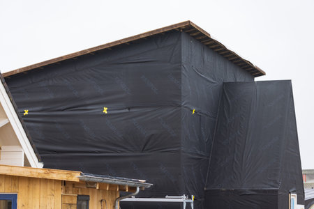 Olst Wijhe, The Netherlands - January 21, 2023: Construction with straw of sustainable houses in Olstergaard a circular nature inclusive neighbourhood in Olst Wijhe in Overijssel The Netherlandsのeditorial素材