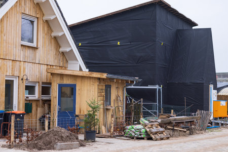 Olst Wijhe, The Netherlands - January 21, 2023: Construction with straw of sustainable houses in Olstergaard a circular nature inclusive neighbourhood in Olst Wijhe in Overijssel The Netherlandsのeditorial素材