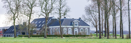 Gaaikemadijk, The Netherlands - March 27, 2023: Large manor Farm house along Gaaikemadijk municipallity Westerkwartier Groningen province The Netherlandsのeditorial素材