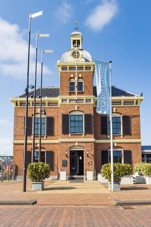Harlingen, The Netherlands - Jun 6, 2023: Cityscape of fishing village Harlingen with historics fish action building t Havenmantsje in Friesland province in The Netherlandsのeditorial素材