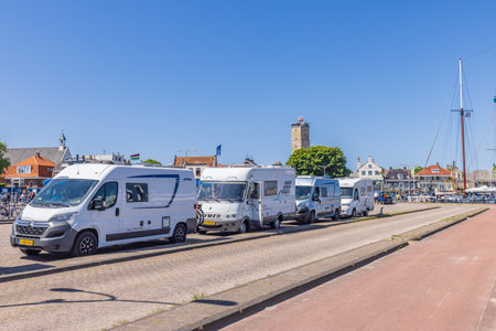 Terschelling, The Netherlands - June 10, 2023: Campers in line for the ferry to Harlingen at West-Terschelling in Friesland province in The Netherlandsのeditorial素材