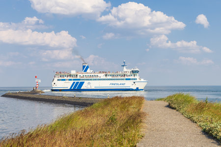Terschelling, The Netherlands - June 11, 2023: Ferry boat Friesland crossing between West-Terschelling and Harlingen to Wadden island Terschelling in Friesland province in The Netherlandsのeditorial素材