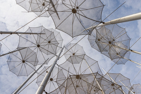 Thessaloniki, Greece - April 29, 2023: Artwork Umbrellas by Zongolopoulos along the weaterfront in Thessaloniki in Central Macedonia in Greeceのeditorial素材