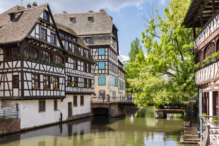 Strasbourg, France - May 14, 2023: Half-timbered houses and canals in old town Petit France in Strasbourg in Elsace region along the Rhine river in Franceのeditorial素材