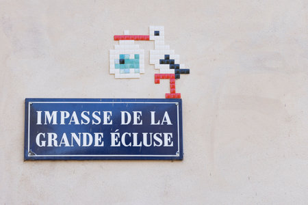 Strasbourg, France - October 16, 2023: Street name sign with symbol of stork bird in old town Petitit France of Strasbourg in Elsace region along the Rhine river in Franceのeditorial素材