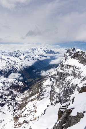 Snow landscape with valley view from Mount Titlis at 3020 meters altitude in Engelberg Switzerland