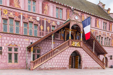 Mulhouse, France - May, 20, 2023: Entrance and flag of former city hall at main square in Mulhouse department Haut-Rhin Elsace region in Franceのeditorial素材