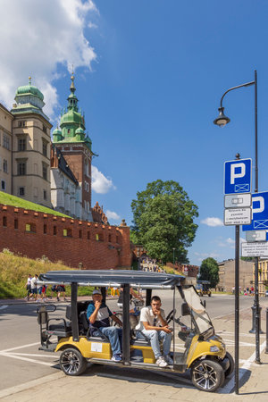 Krakow, Poland - July 18, 2023: Drivers waiting for tourists to take sightseeing trip in front of Wawel castle in Krakow Malopolska region in Polandのeditorial素材
