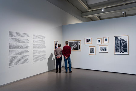 Amstelveen, The Netherlands - Januari 21, 2024: Visitors looking at portrait of famous Dutch photographer Anton Corbijn in The Cobra Museum of modern art in Amstelveen, The Netherlands.のeditorial素材