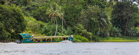 El Castillo , Nicaragua - March 11, 2024: Transport by boat along the San Juan river and Biosphere reserve along the border of Nicaragua and Costa Ricaのeditorial素材
