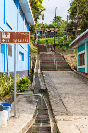 El Castillo , Nicaragua - March 11, 2024: Entrance road to fortress of El Castillo village along the...