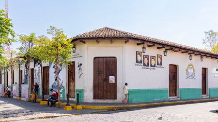 Leon, Nicaragua - March 17, 2024: Cityscape with colorful university building with mural portraits of scientists in the center of Leon in Nicaraguaのeditorial素材