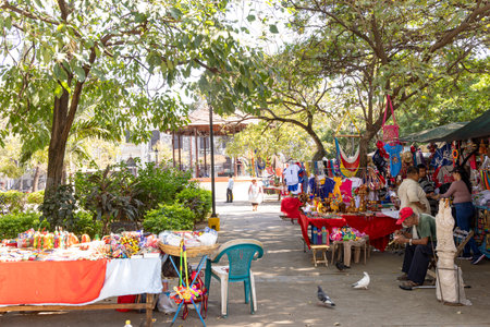 Leon, Nicaragua - March 16, 2024: Market at central market in fornt of the white cathedral of city Leon in Nicaraguaのeditorial素材