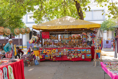 Leon, Nicaragua - March 16, 2024: Market at central market in fornt of the white cathedral of city...