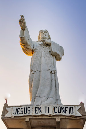 San Juan del Sur, Nicaragua - March 23, 2024: Towering contemporary Christ of the Mercy statue standing on a cliff above the bay of San Juan del Sur.のeditorial素材