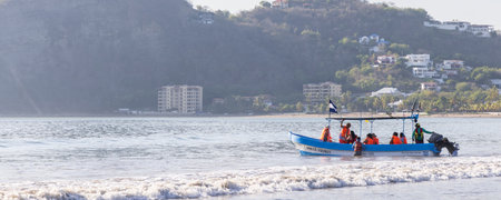 San Juan del Sur, Nicaragua - March 23, 2024: Tourist fishing boat in bay of San Juan del Sur coastal town on the Pacific Ocean in the Rivas department in southwest Nicaragua.のeditorial素材