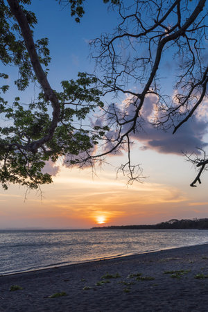 Tropical sunset at Ometepe vulcano island in southwest Nicaragua Lake Cocibolca in Nicaragua.の写真素材