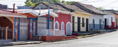 Colorful houses with bars in fornt of windows and doors in Granada on the shores of Lake Nicaragua...