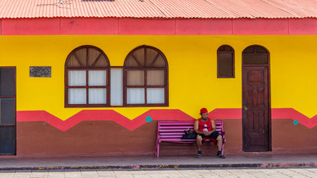 Masaya, Nicaragua - March 18, 2024: Local Man with cap in front of Museum del Folcolor in Masaya city in Nicaragua Central America. Focus on dance, local myths and cultural traditions of Masayaのeditorial素材