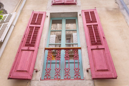 Colorful pink windows in Piran Istrian peninsula along the Adriatic sea in Sloveniaの写真素材